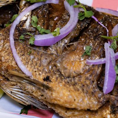 Fried whole Mojarra fish.