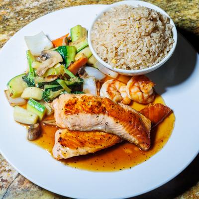 Salmon hibachi with vegetables and rice.