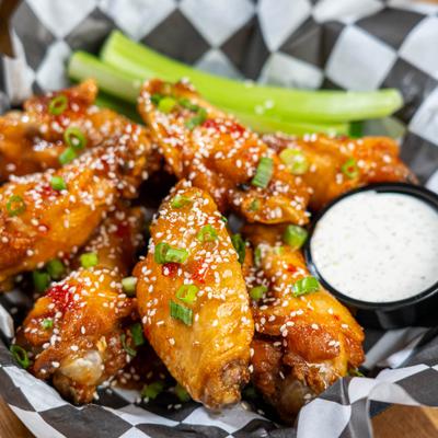 Sweet Asian chili wings served with ranch and celery.