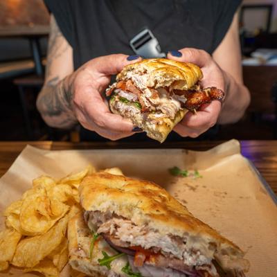 The Incredible Turkey sandwich served with chips.