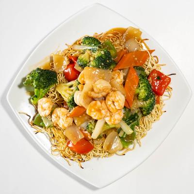 Noodles sauteed with shrimp and veggies.