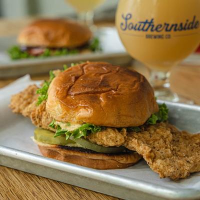 Southern Fried Chicken Sandwich accompanied with beer