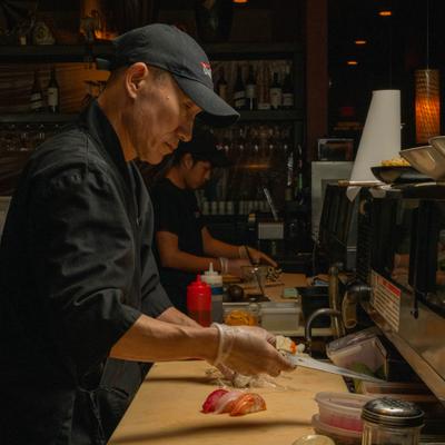 The staff preparing food.