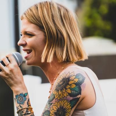 Person singing into the microphone.