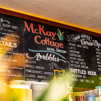 Menu board with signage, drinks and specials listed.