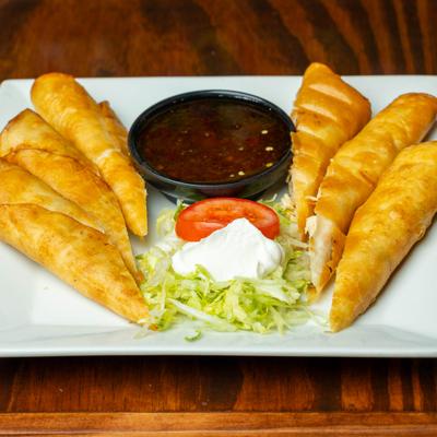 Chicken and cheese taquitos served with lettuce, sour cream and house made jalapeno sauce.
