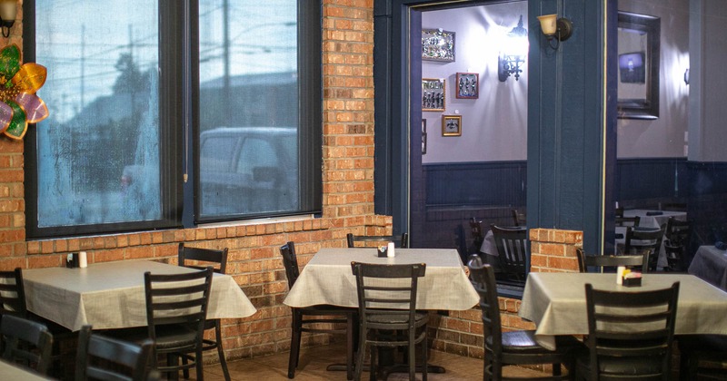 Interior, tables and chairs in dining area