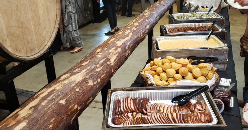 Different dishes served in silver catering containers