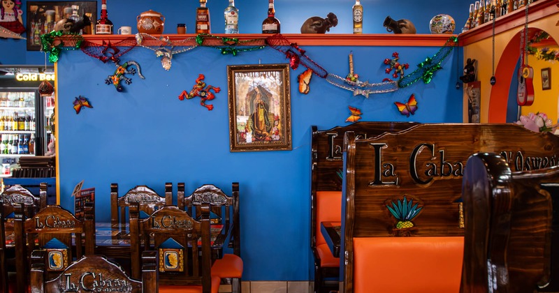 Interior seating area with chairs, tables and booths, colorful decoration