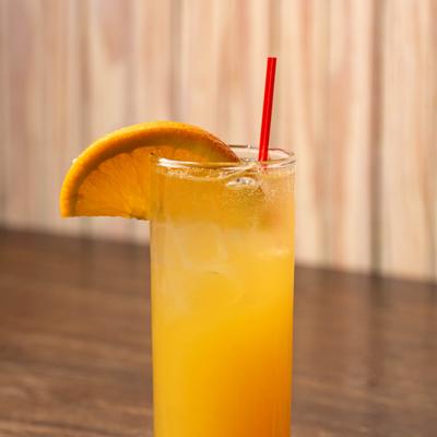 Cocktail served in a highball, garnished with a orange slice.