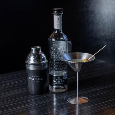 Martini accompanied by a bottle of tequila and a shaker.