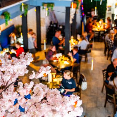 Bar area, bar, guests, view from the gallery over floral decor.