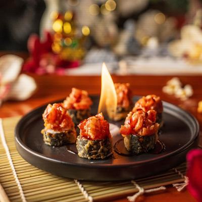 Dynamite Roll with open flame incorporated into the presentation.