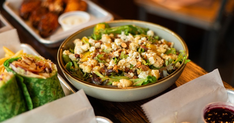 Salad with mixed greens, cauliflower, toasted almonds, and blue cheese