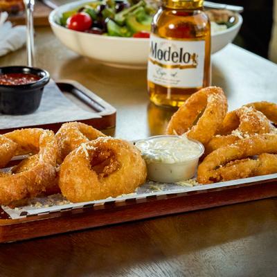 Onion rings served with blue cheese dipping sauce.