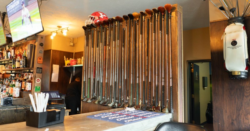 Golf club rack, golf clubs, part of the bar