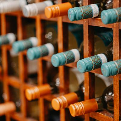 Close up of racks with displayed wine.