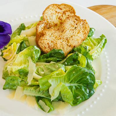 Plate of Caesar salad.