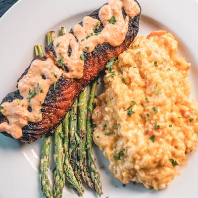 Blackened salmon  served with risotto and asparagus