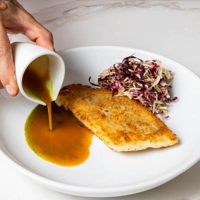 Pan fried cod with citrus thyme butter sauce and radicchio.