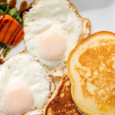 Two eggs, pancakes, and bacon.