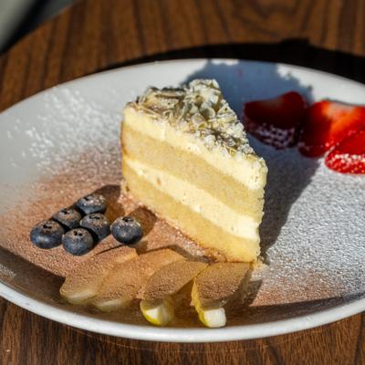 Mary’s Pistachio Cake served with fresh fruit.