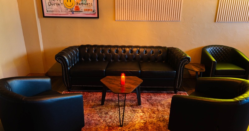 Seating area, leather sofa and armchairs
