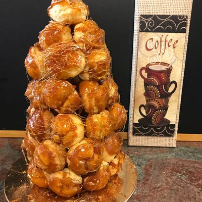 French pastry puffs filled with custard and bound with threads of caramel.
