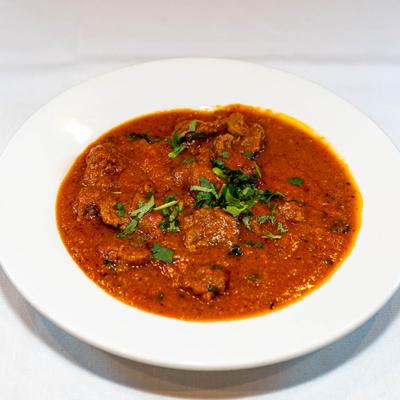 Lamb Tikka Masala, tomato sauce and spices cooked with lamb and curry