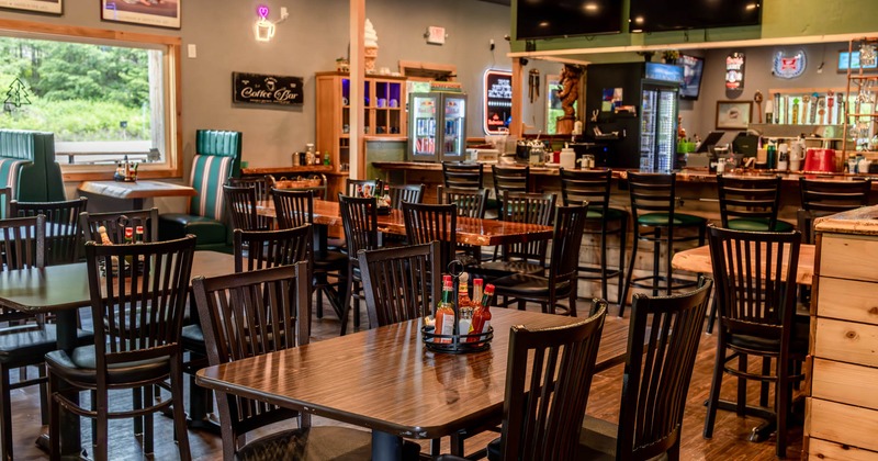 Interior, tables with chairs waiting for the guests