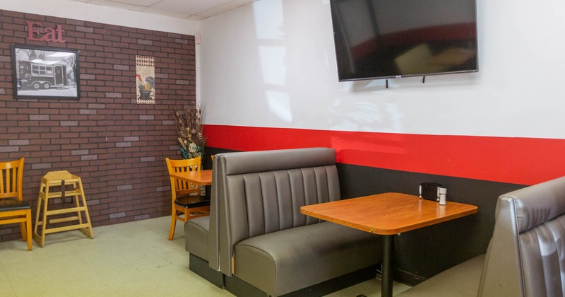Interior, dining booths, wall TV screen