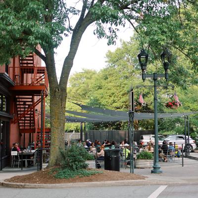 Outdoor dining patio with shade sails.