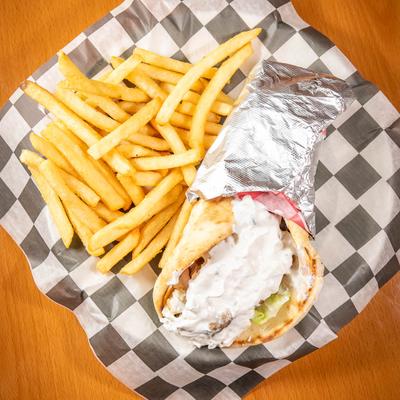 Gyro Pita Wrap, with onion, tomatoes, tzatziki, feta, and fries.