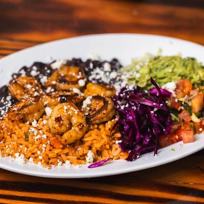 Shrimp served over rice and beans, with picked red cabbage, pico de gallo, guacamole.