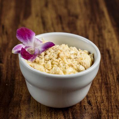 Banana Pudding garnished with a purple orchid.