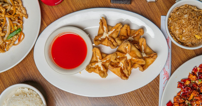 Crab Rangoons served with a dip on the side
