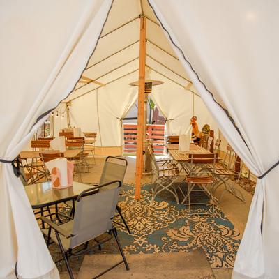 A tent with seating area inside