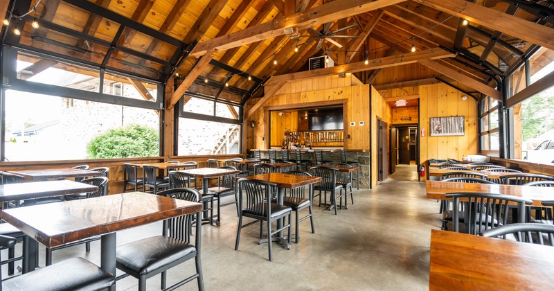 Exterior, covered patio with chairs and tables
