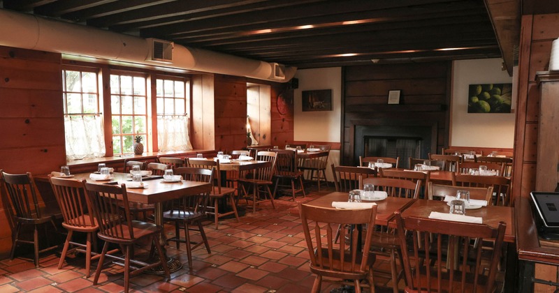 Interior, wooden tables and chairs ready for guests