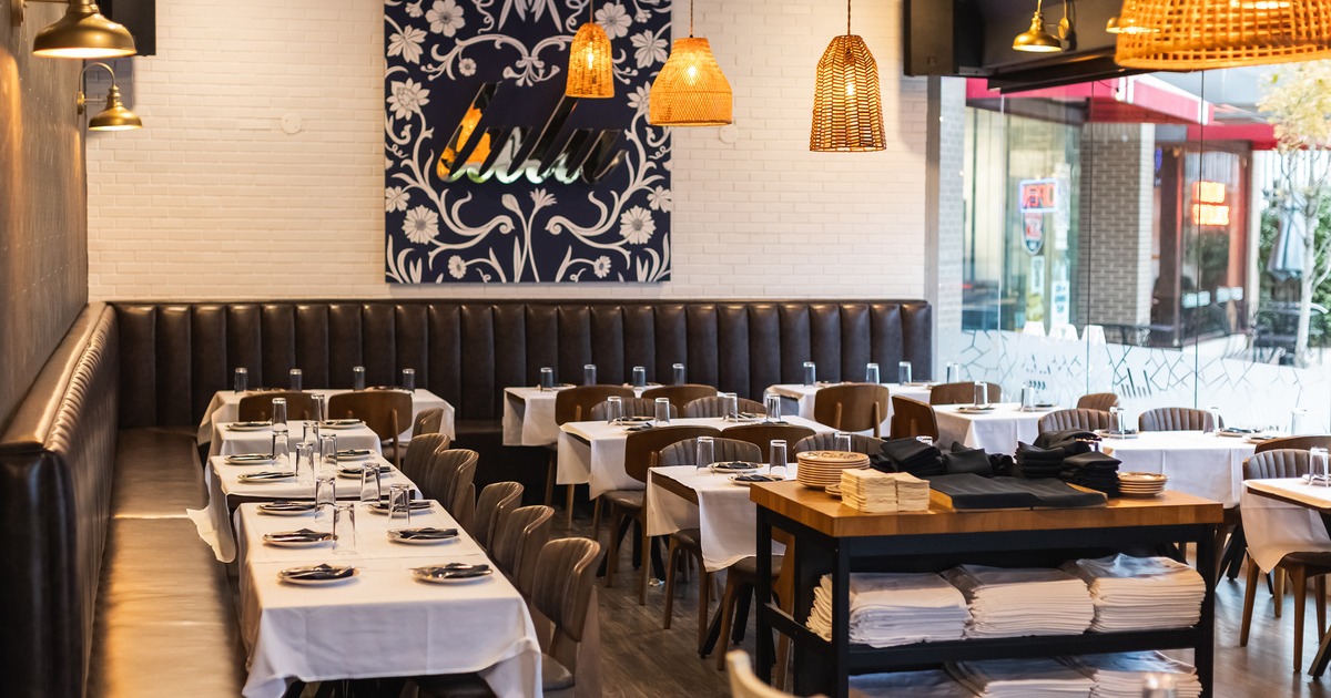Nicely done interior dining area with set tables ready for guests