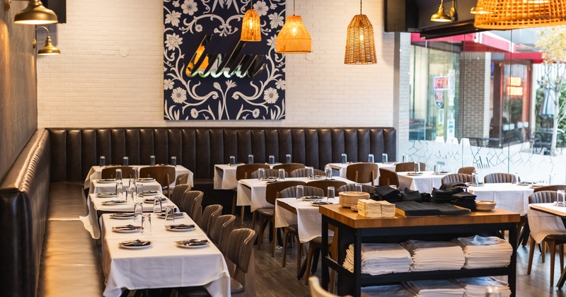 Nicely done interior dining area with set tables ready for guests