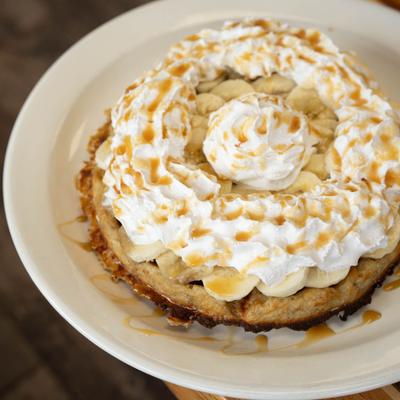Waffle with bananas and whipped cream.