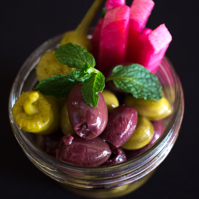Jar with olives and other food
