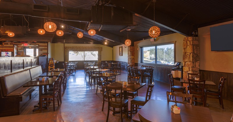 Interior, seating area with tables, chairs, and seats