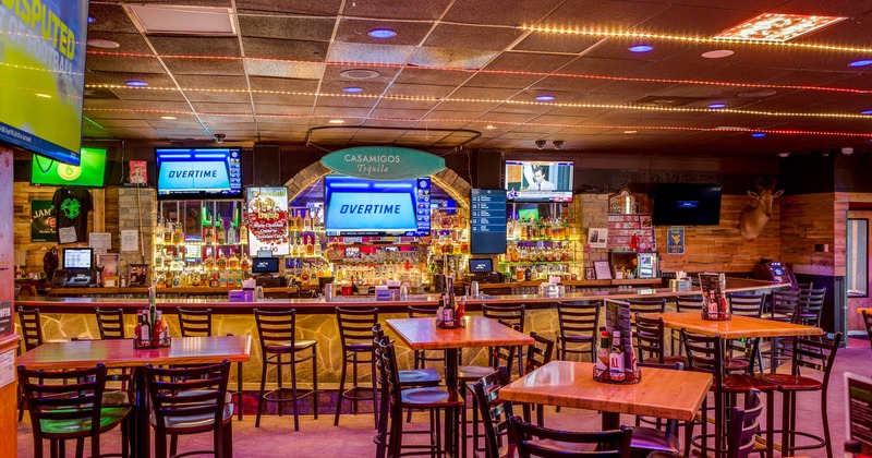Interior, dining and bar area, TVs above the bar