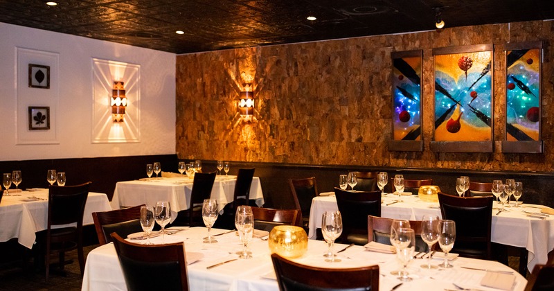 Interior, dining tables set for guests