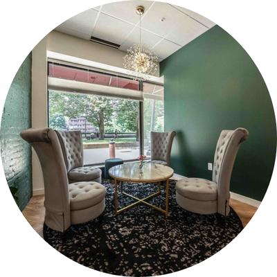 Leather armchairs and a marble coffee table.