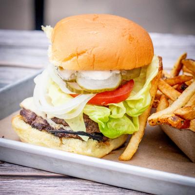 Burger with fries on the side.