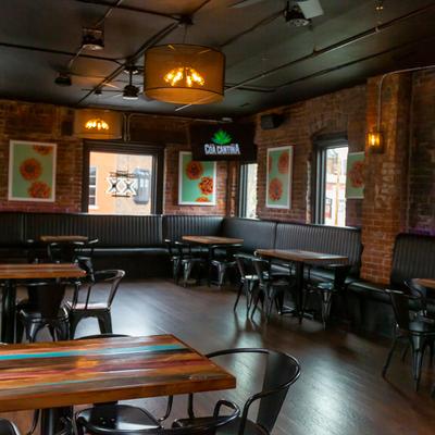 Interior, upstairs, tables, long leather bench seating and chairs