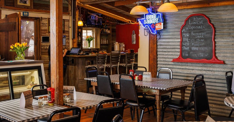 Interior, seating area, tables ready for guests
